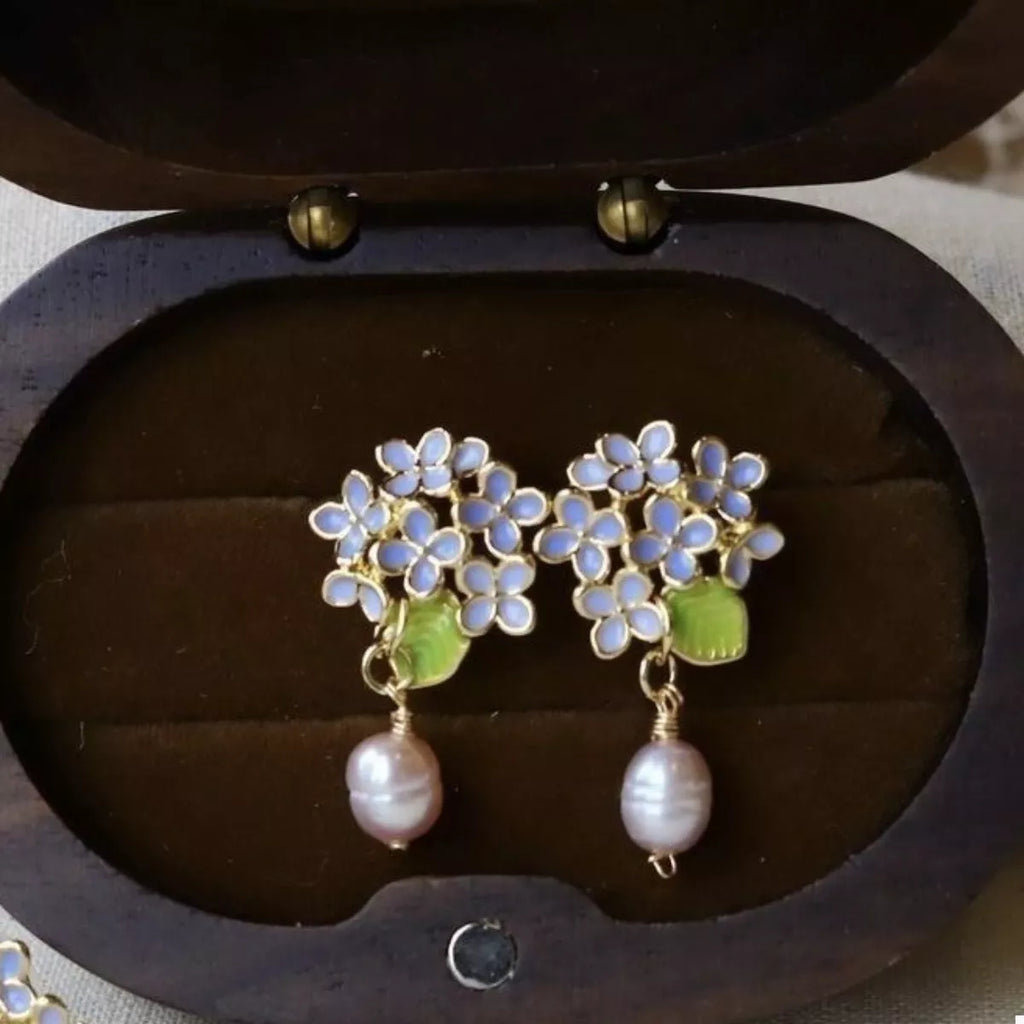 Blue hydrangea-inspired floral earrings with pearl drops