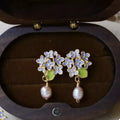 Blue hydrangea-inspired floral earrings with pearl drops