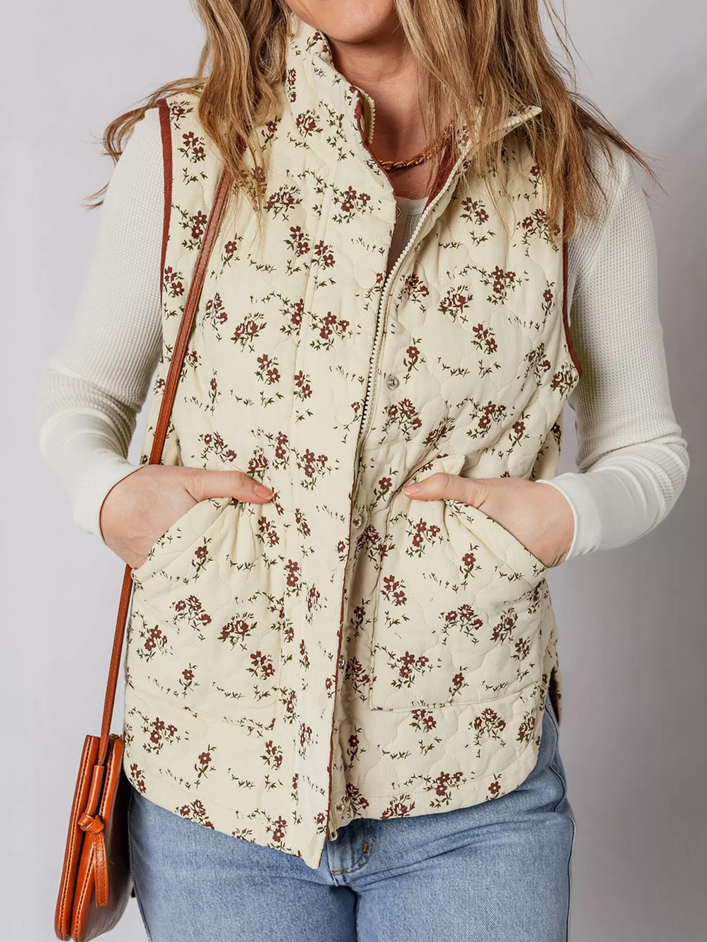 Beige floral quilted zip vest with patch pockets