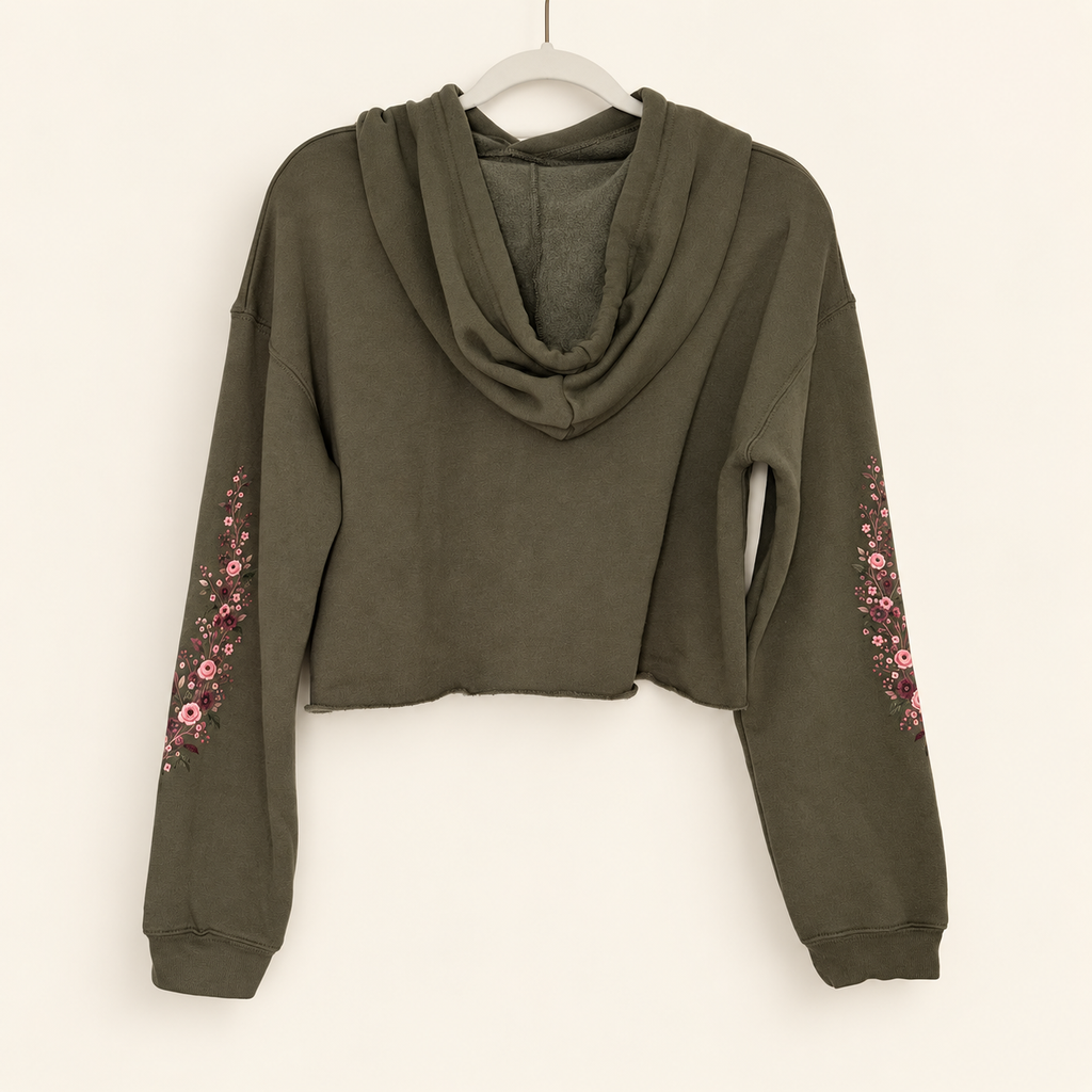 Back view of olive Falling For You cropped hoodie with plain back, draped hood and floral print along both sleeves