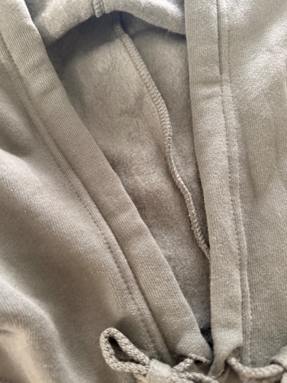 Soft fleece interior detail of the Falling For You olive floral cropped hoodie